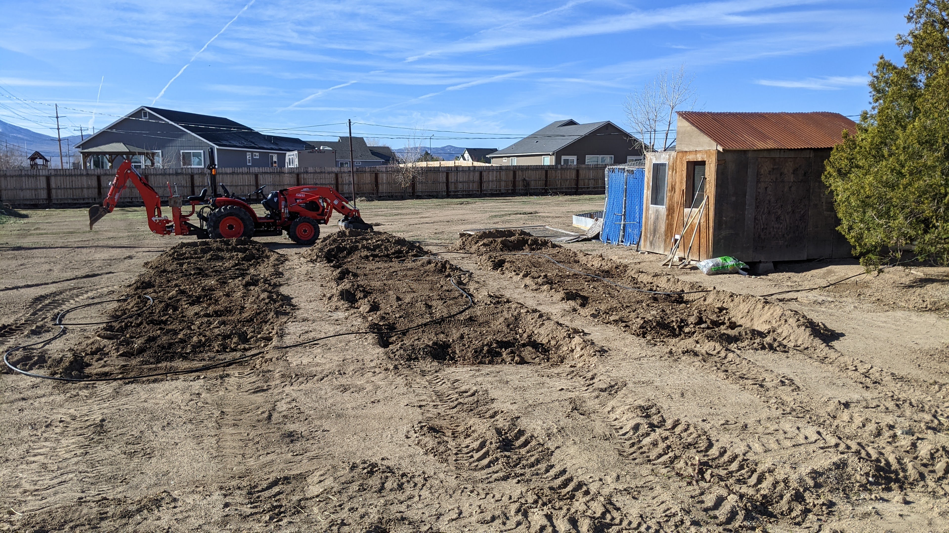 In ground vegetable garden soil mixed with wood chips and manure.