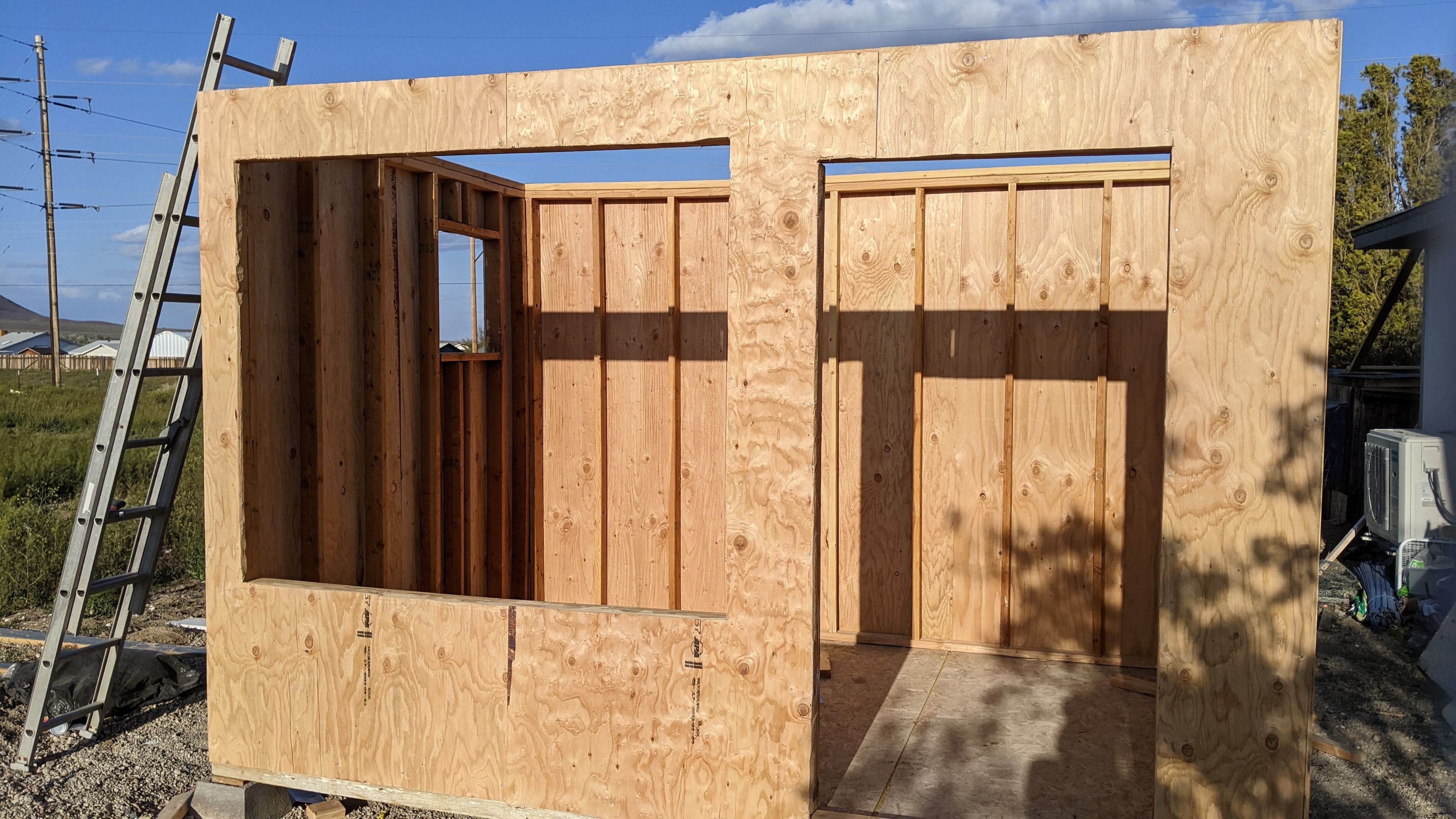 A stick frame building with plywood sheathing on all of it.